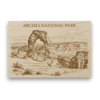 Wooden sign with engraved image of Arches National Park and text.