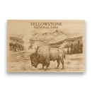 Wooden plaque with engraved image of a bison and mountains, featuring 'Yellowstone National Park' text.