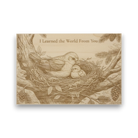Wooden plaque with engraved image of a bird and baby bird in a nest, surrounded by branches and leaves.