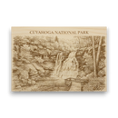 Wooden plaque with engraved image of Cuyahoga National Park and text.