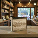 Wooden box with Grand Teton National Park design on a wooden table in a store setting.