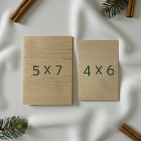 Two wooden boards with dimensions '5x7' and '4x6' on a white surface with decorative elements.