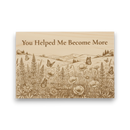 Wooden plaque with nature design and engraved text 'You Helped Me Become More' on a white background